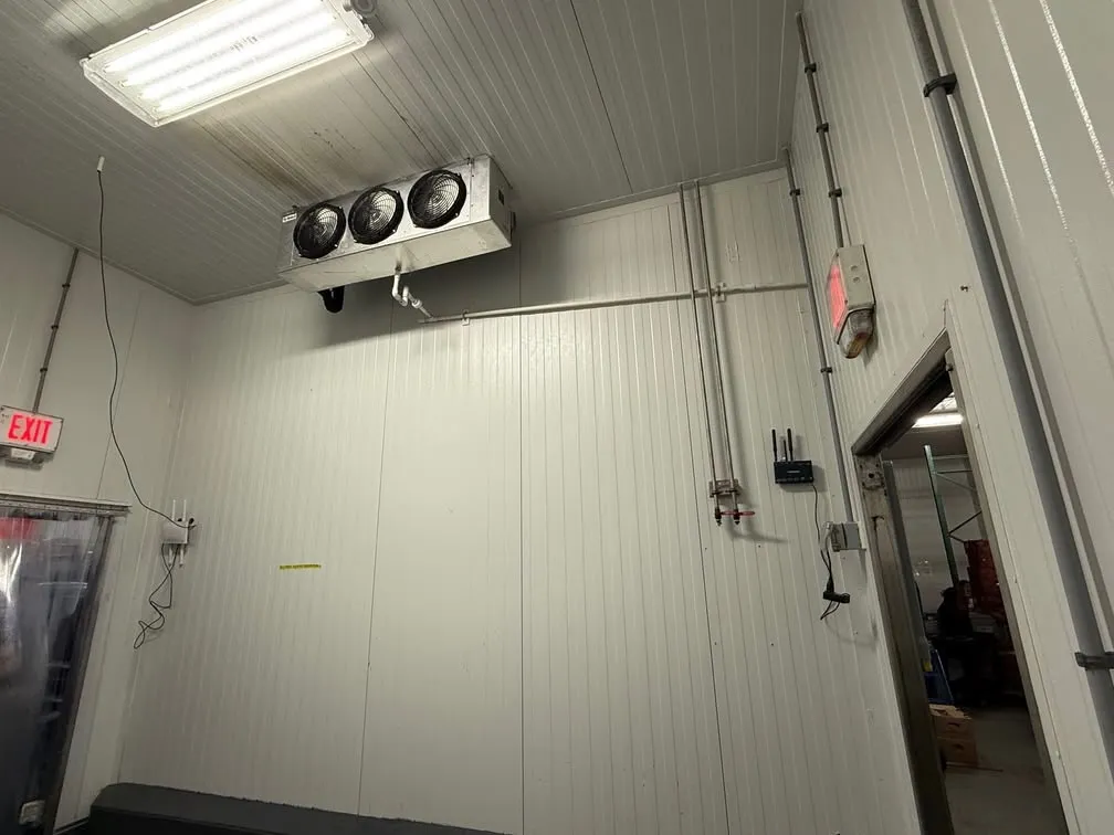 Walk-in cooler evaporator, refrigerant lines and temperature monitoring equipment